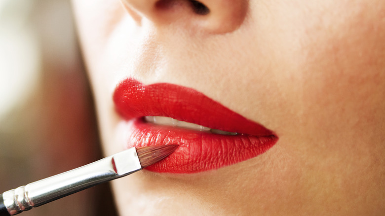 Lipstick being applied with a brush