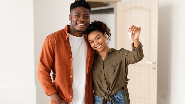 couple holding house keys