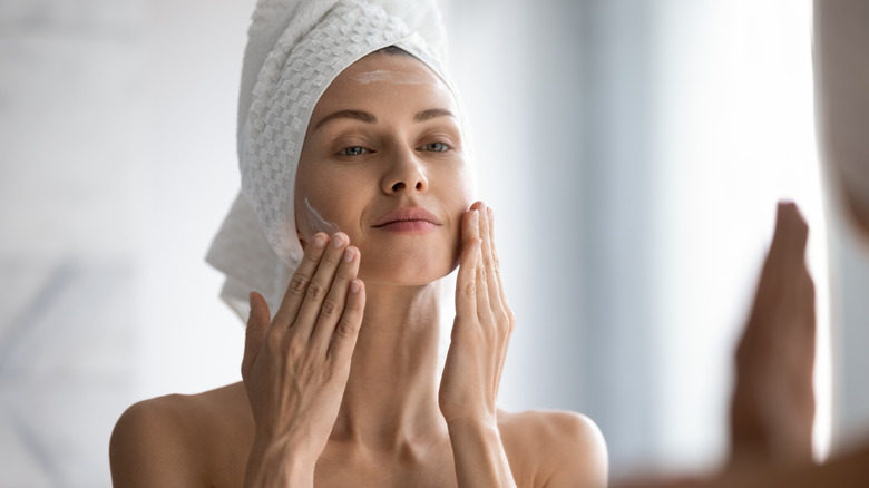 woman patting in skincare