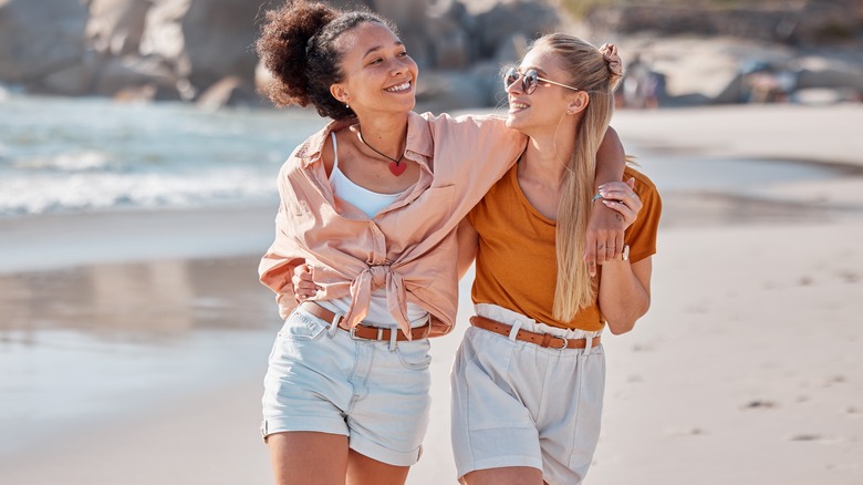 Couple smiles on beach