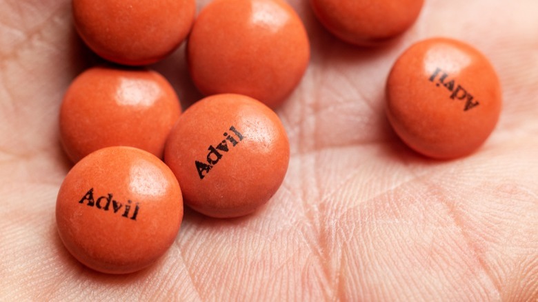 Handful of orange Advil pills