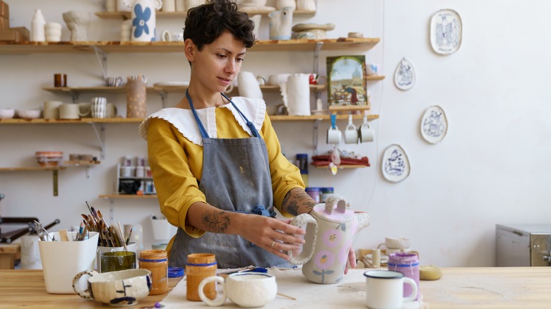 person doing pottery