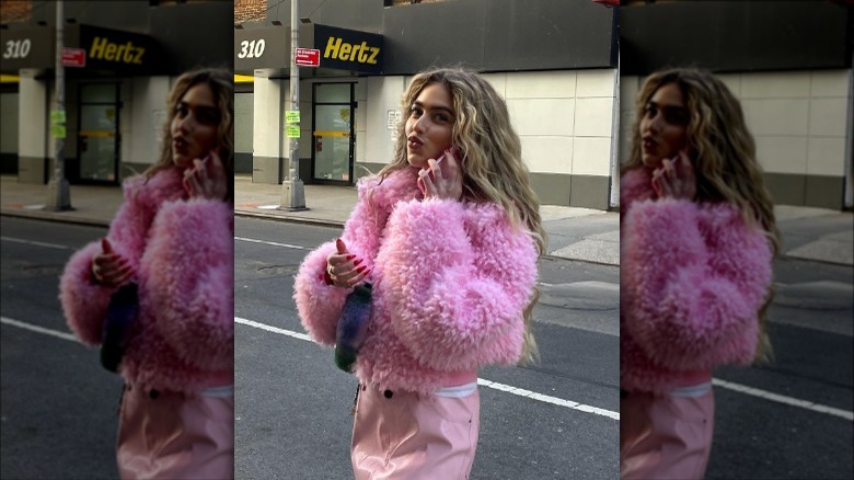 woman in fluffy pink jacket