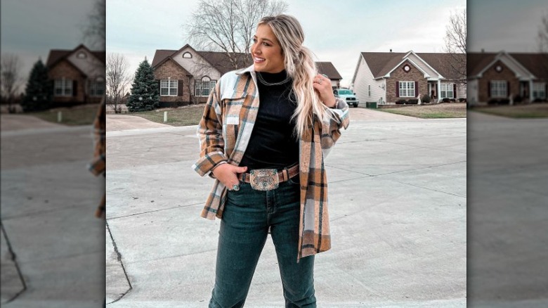 Woman wears belt with large buckle