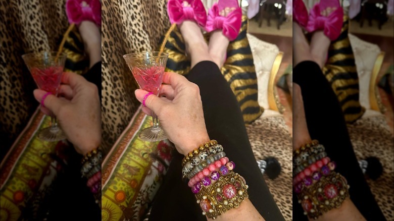 Woman wears stack of multi-colored bracelets 