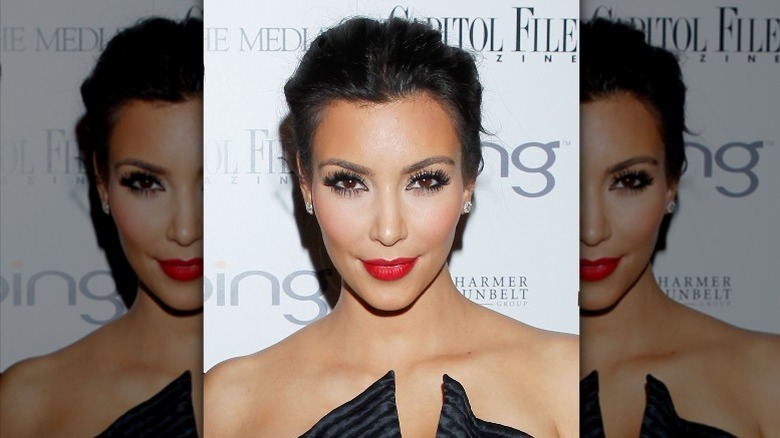 Kim Kardashian posing with red lips