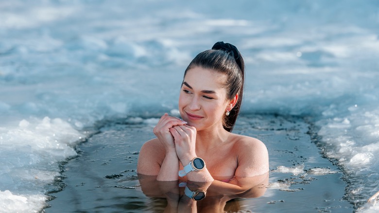 woman swimming in frozen lake