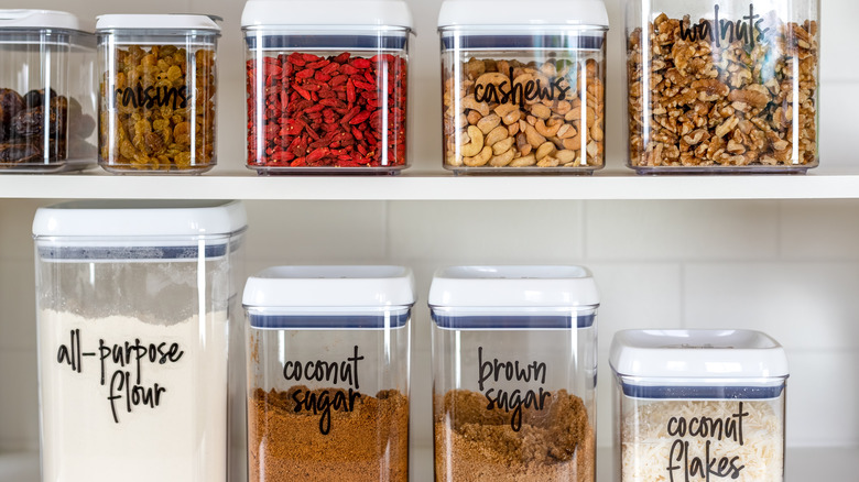 Kitchen items organized in labeled jars