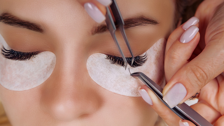 Woman getting her eyelashes done