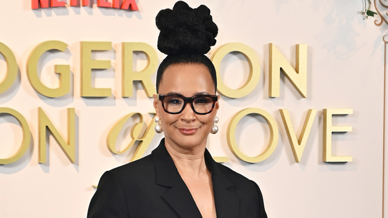 Golda Rosheuvel in black glasses pearl earrings