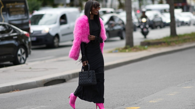 woman wearing fuzzy pink lady jacket