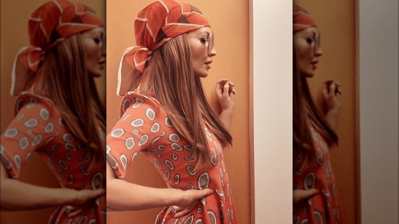 Woman in orange headscarf