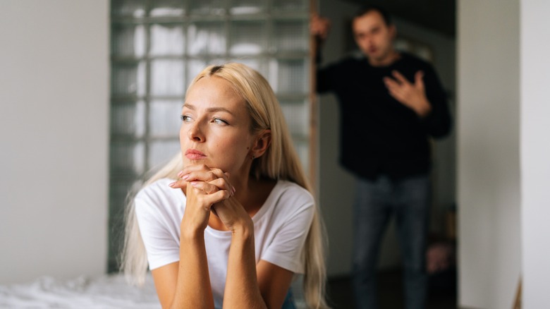 woman turning back on man 