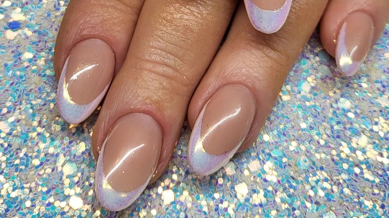 close up of nude pink with french tip nails