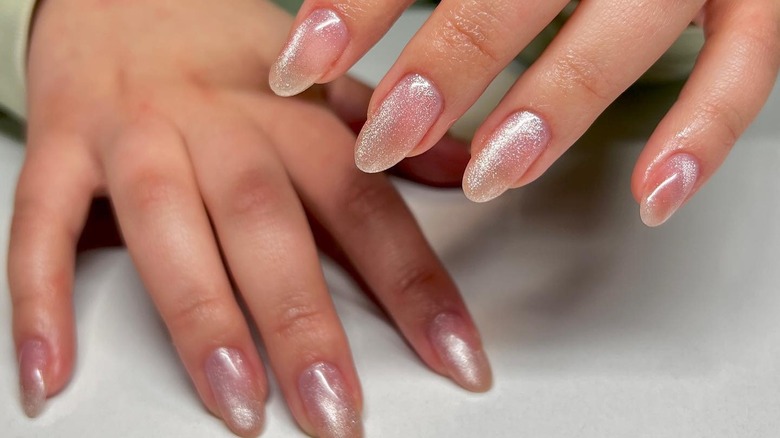 close up on shiny nude pink nails