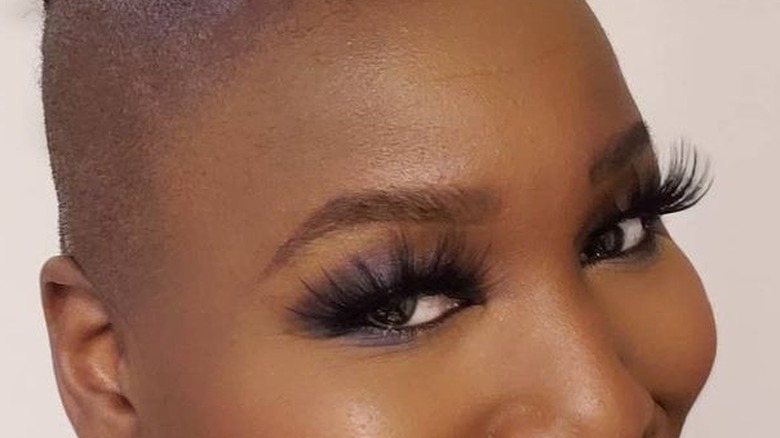 Person wearing smoky eye with lashes