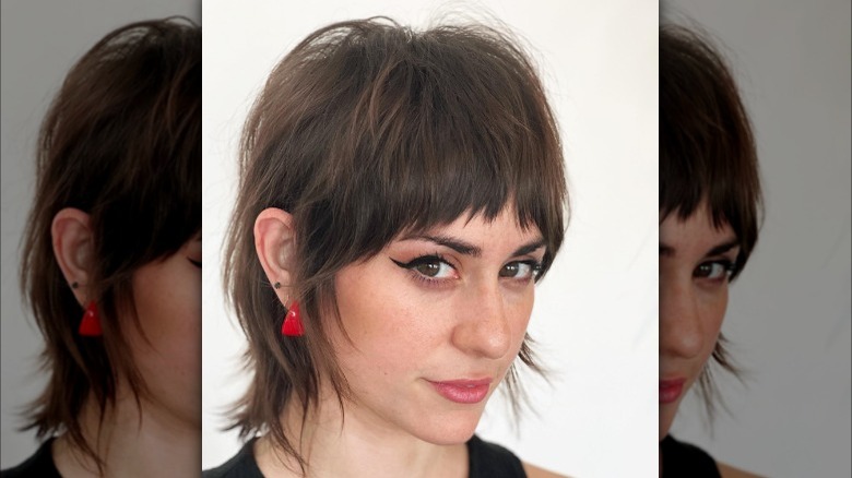 Girl wearing bangs with a lop haircut