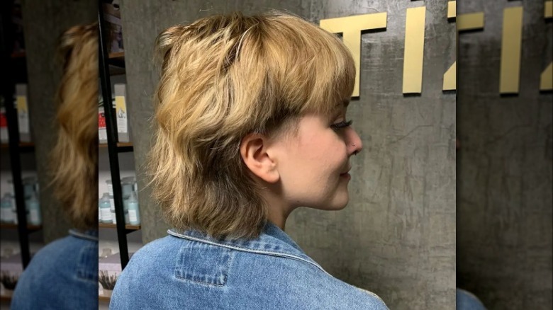 Girl wearing a stacked lop haircut.