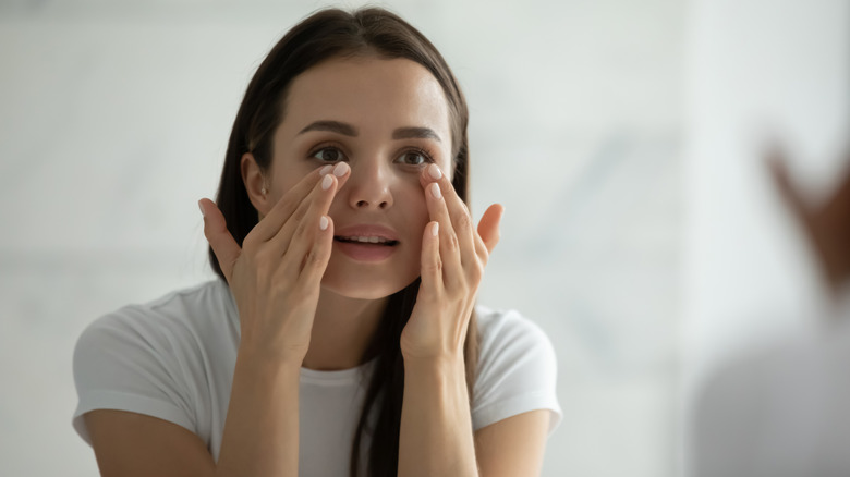 Woman performs DIY buccal massage