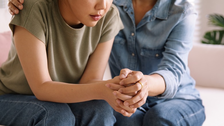 Woman comforting a friend in crisis