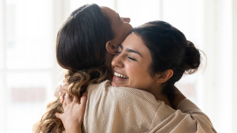 Two friends hugging