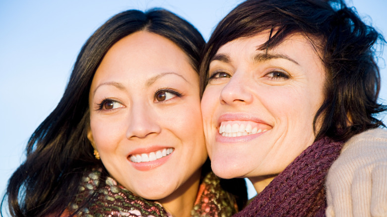 Two women hugging and smiling