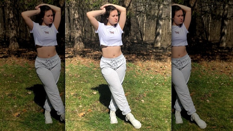 woman in sweatpants and crop top