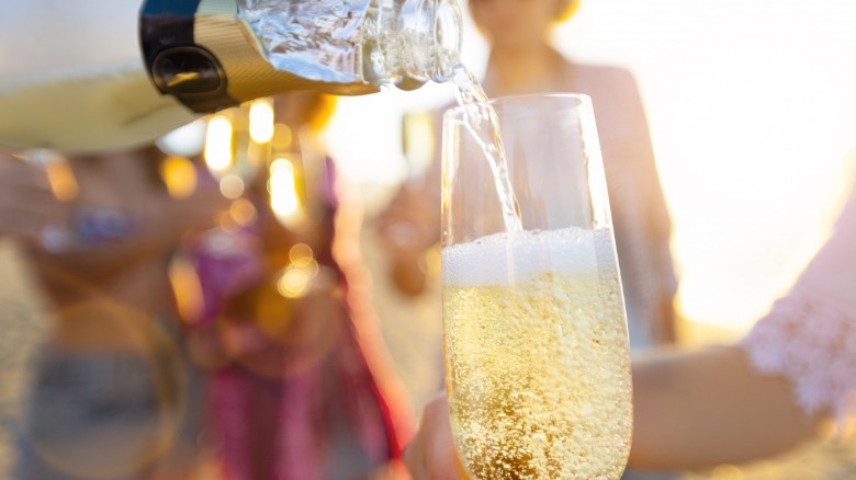 Close up of pouring champagne