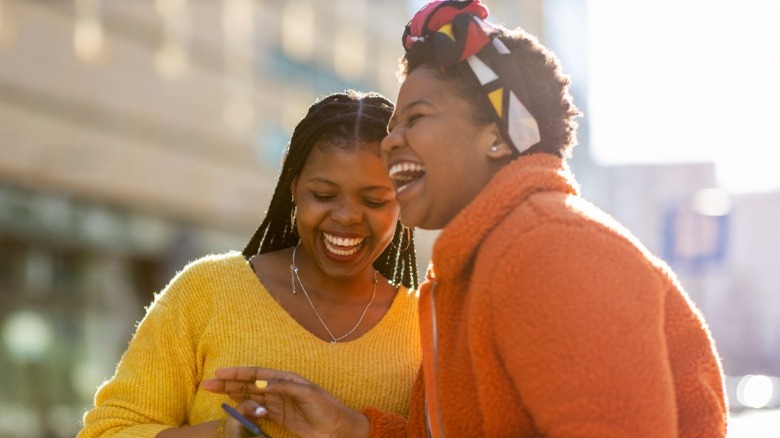 Two woman laughing