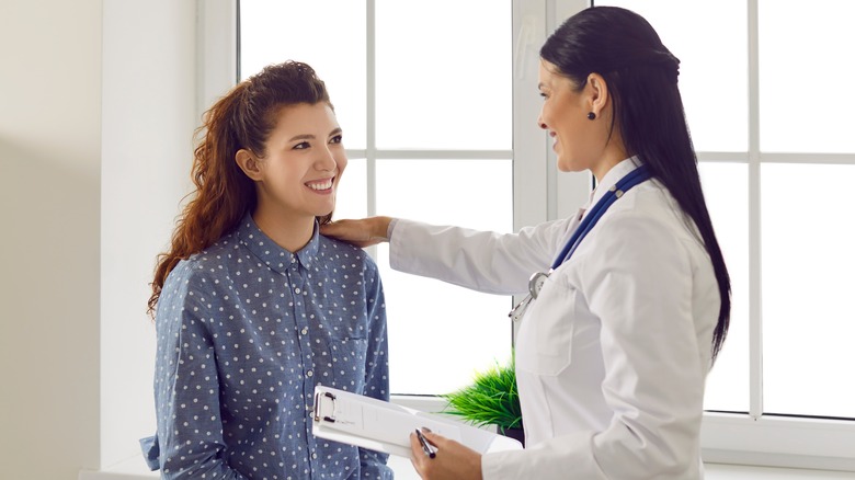 woman talking to doctor