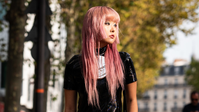 Alternative woman with Millennial pink hair