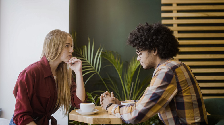 Couple talking over coffee