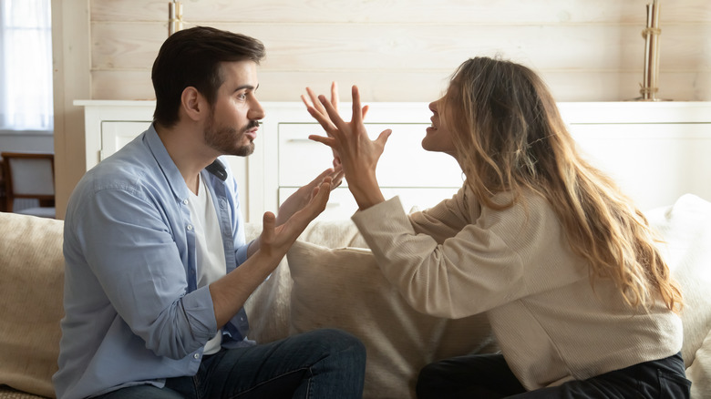 Couple arguing on the sofa