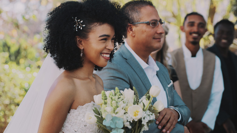 Bride walking down aisle with dad