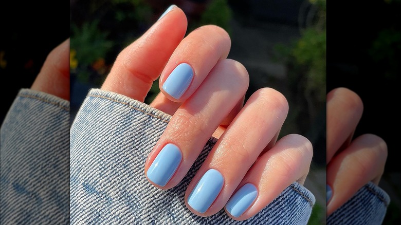 Close up of light blue nails