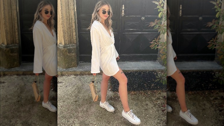 Girl wearing sneakers with dress.