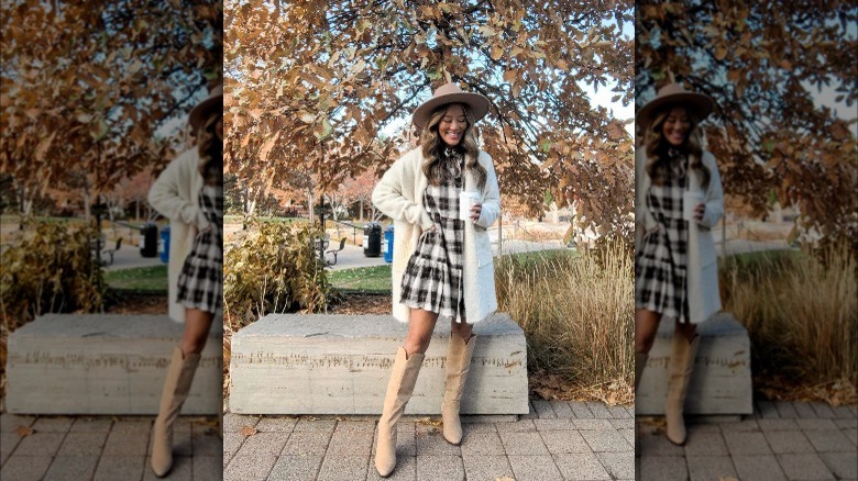 Girl wearing knee-high boots with dress.