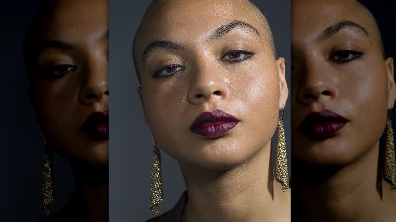 woman wearing grungy purple lipstick