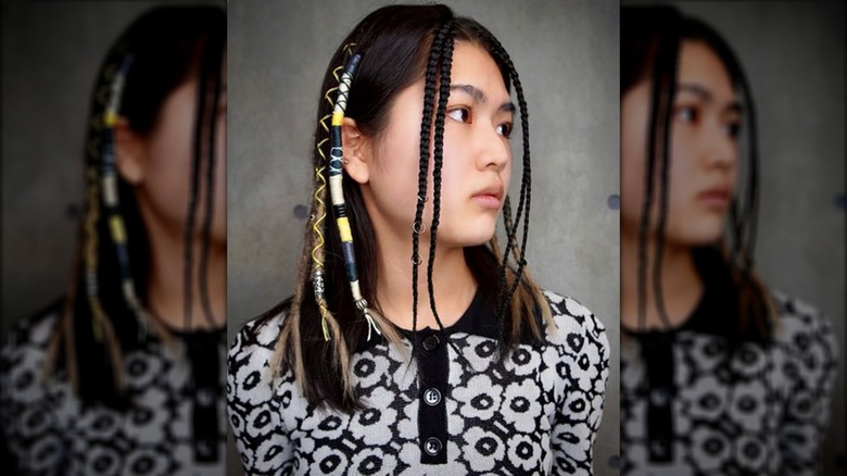 Woman with tiny front braids 