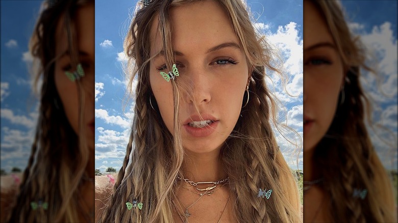 Woman with braids wearing butterfly clips