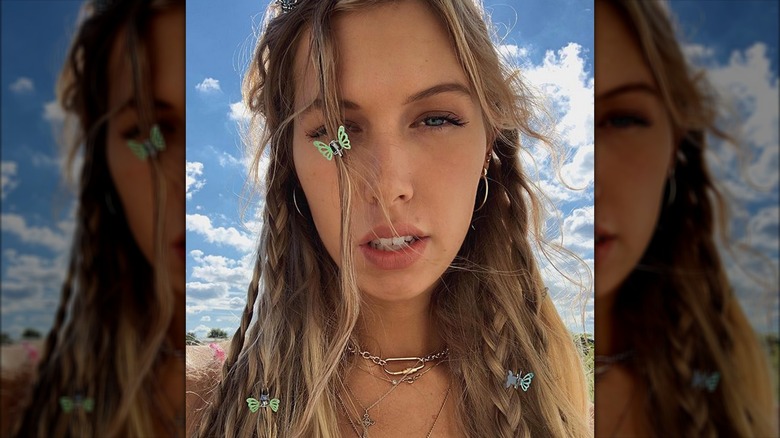 Woman with braids wearing butterfly clips