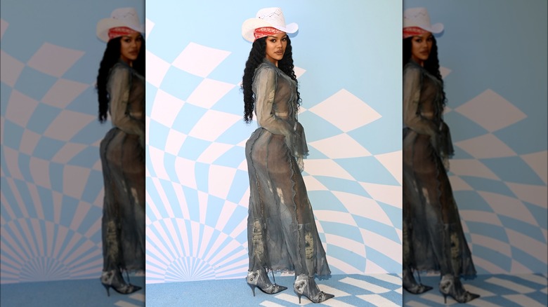 Teyana Taylor wearing a sheer dress and cowboy hat at Coachella.