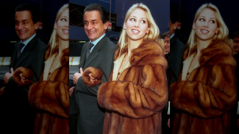 Anna Kournikova wearing a long fur coat.