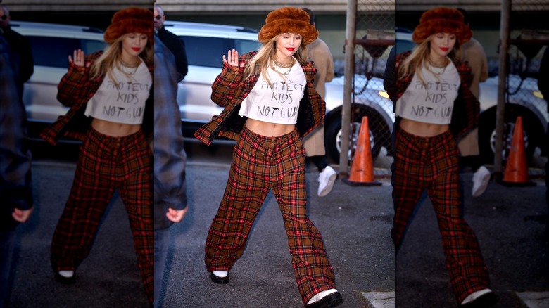 Miley Cyrus in plaid separates and fuzzy hat