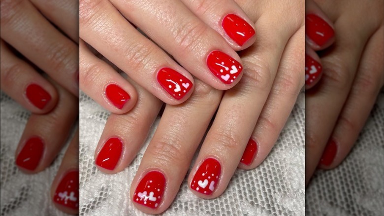 Classic red manicure with hearts 