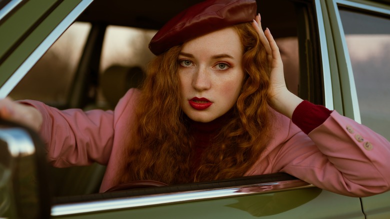 woman red lips driving