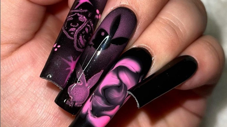 Black nails with pink designs