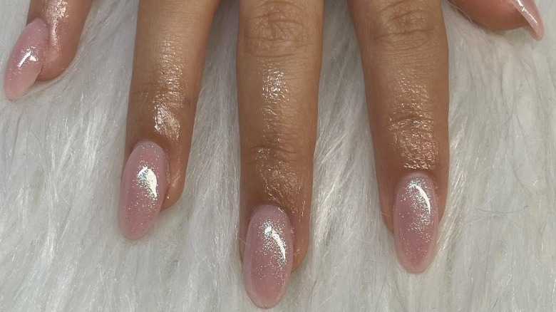 woman with nude shimmer nails