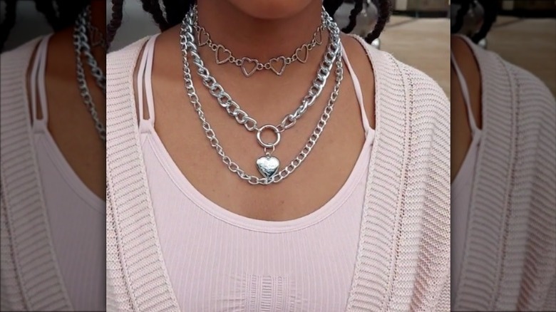 girl wearing chunky silver jewelry