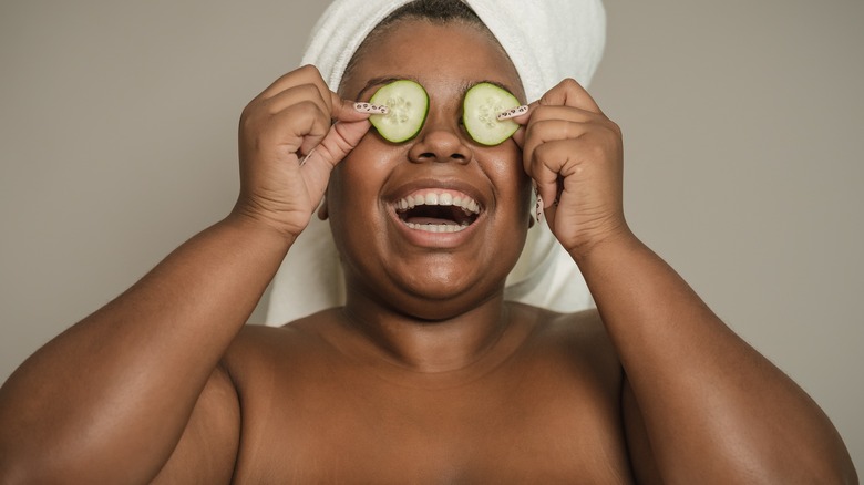 Model with cucumbers on eyes 